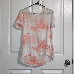 White shirt with pink/ coral design